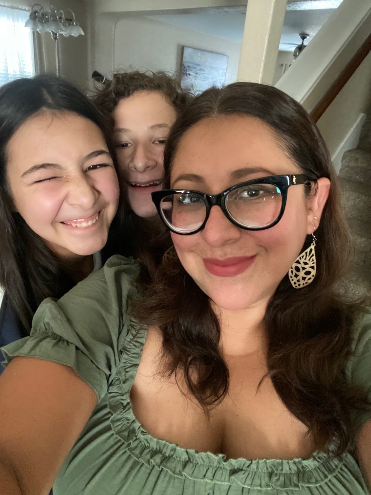 The Roots Coffee Culture family — Carlos, Estrella, and Ziara